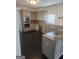 Modern kitchen with stainless steel appliances, gray cabinets, and granite countertops at 718 Avalon Way, Peachtree City, GA 30269