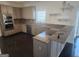 Modern kitchen with stainless steel appliances, granite counters, and breakfast bar at 718 Avalon Way, Peachtree City, GA 30269
