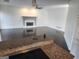 Spacious living room featuring a white fireplace, ceiling fan, and dark hardwood floors at 718 Avalon Way, Peachtree City, GA 30269