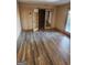Open living area showcasing sleek hardwood floors and glass patio door access at 718 Avalon Way, Peachtree City, GA 30269