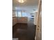 Open floor plan featuring a kitchen with granite countertops and a spacious living area at 718 Avalon Way, Peachtree City, GA 30269