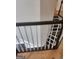 Dark wood staircase with white banister at 718 Avalon Way, Peachtree City, GA 30269
