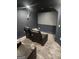 Home theater boasts plush reclining seating, carpet, and large screen for an immersive viewing experience at 718 Avalon Way, Peachtree City, GA 30269