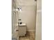 Powder room features a granite topped vanity and framed mirror at 3685 Washington Rd, East Point, GA 30344