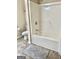Cozy bathroom featuring a shower-tub combination and tile flooring at 3685 Washington Rd, East Point, GA 30344