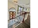 Elegant foyer with a wooden staircase and stunning crystal chandelier at 3685 Washington Rd, East Point, GA 30344