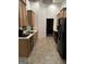 Well-lit kitchen with modern appliances and tan cabinetry at 3685 Washington Rd, East Point, GA 30344