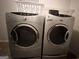 Laundry room features a side-by-side silver washer and dryer at 3685 Washington Rd, East Point, GA 30344