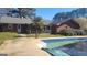 Backyard with a brick house, in-ground pool, and nice trees at 1083 Hampton Rd, Hampton, GA 30228