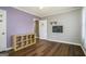 Cozy bedroom with hardwood floors, a playful design and decorated door frame at 1083 Hampton Rd, Hampton, GA 30228