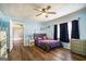 Comfortable bedroom features hardwood floors, celestial accents, and lots of light at 1083 Hampton Rd, Hampton, GA 30228