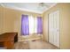 Bedroom with carpet and a ceiling fan, featuring natural light and a closet at 1083 Hampton Rd, Hampton, GA 30228