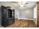 Living room with hard wood floors, a large china cabinet and an open floor plan at 1083 Hampton Rd, Hampton, GA 30228