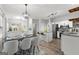 Dining and kitchen area featuring a modern table set and stainless steel appliances at 5863 Landers Loop, Fairburn, GA 30213