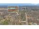 Aerial view of a +/- 5.49 acre wooded lot, with charming home inset at 81 Bowers Rd, Moreland, GA 30259