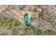 Birds eye view of a home with green roof and mature trees surrounding the property at 81 Bowers Rd, Moreland, GA 30259