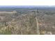 Aerial view of the forested property and surrounding landscape with a home nestled in the trees at 81 Bowers Rd, Moreland, GA 30259