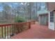 Exterior shot of back deck area with wood planks and partial view at 81 Bowers Rd, Moreland, GA 30259