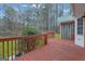 Wood deck featuring views of the backyard and woods at 81 Bowers Rd, Moreland, GA 30259