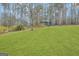 Expansive green lawn with storage shed, ideal for outdoor activities and enjoying nature at 81 Bowers Rd, Moreland, GA 30259
