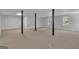 Large basement with structural poles and windows at 81 Bowers Rd, Moreland, GA 30259