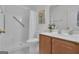 Bathroom featuring walk-in shower, vanity, and decorative floral accents at 81 Bowers Rd, Moreland, GA 30259