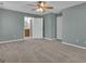 Bedroom featuring neutral walls, carpeting, and ensuite bathroom and closet at 81 Bowers Rd, Moreland, GA 30259