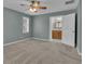Carpeted bedroom featuring ceiling fan and access to the ensuite bathroom at 81 Bowers Rd, Moreland, GA 30259
