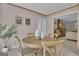 Cozy dining room featuring a round wooden table with chairs and neutral decor at 81 Bowers Rd, Moreland, GA 30259