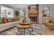 Living room showcasing a brick fireplace, wood mantle, plush seating, and inviting decor at 81 Bowers Rd, Moreland, GA 30259