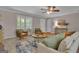 Bright living room with hardwood floors, a cozy seating area and a large window for natural light at 81 Bowers Rd, Moreland, GA 30259