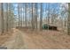 Landscape shot of the property showing the house, outbuilding, and driveway at 81 Bowers Rd, Moreland, GA 30259
