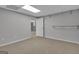 Neutral room with drop ceiling and tan carpeting with open door at 81 Bowers Rd, Moreland, GA 30259