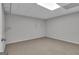 Neutral room with drop ceiling and tan carpeting at 81 Bowers Rd, Moreland, GA 30259