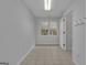 Neutral room with view of the outdoors with access door and window at 81 Bowers Rd, Moreland, GA 30259