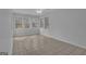 Bright sunroom with tile floors, ceiling fan, and lots of natural light from surrounding windows at 81 Bowers Rd, Moreland, GA 30259