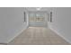 Bright sunroom with tile floors, ceiling fan, and natural light with access door at 81 Bowers Rd, Moreland, GA 30259