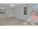 Bright sunroom with tile floors, ceiling fan, and access to back deck at 81 Bowers Rd, Moreland, GA 30259