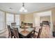 Bright dining room featuring a hardwood floor, table set, and bay window at 1233 Kern Cv, Mcdonough, GA 30253