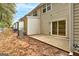 Back exterior featuring a patio and view of the townhouse's exterior and surrounding greenery at 3802 Austin Park Ln, Decatur, GA 30032