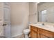 Bathroom with a wood vanity, white toilet and vanity mirror at 3802 Austin Park Ln, Decatur, GA 30032