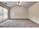 Bedroom with carpet, large window, and a ceiling fan at 3802 Austin Park Ln, Decatur, GA 30032