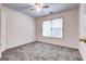 Bedroom with ceiling fan, window with blinds, neutral carpet, and white walls at 3802 Austin Park Ln, Decatur, GA 30032