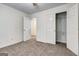 Bedroom with carpeted floors and an open closet with shelving at 3802 Austin Park Ln, Decatur, GA 30032