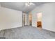 Bright bedroom with vaulted ceiling, ceiling fan, neutral carpet, and access to bathroom at 3802 Austin Park Ln, Decatur, GA 30032