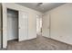 Bedroom with carpet, closet doors, and doors leading to other rooms at 3802 Austin Park Ln, Decatur, GA 30032