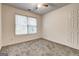 Bedroom with neutral carpet, a ceiling fan, and a double door closet at 3802 Austin Park Ln, Decatur, GA 30032