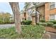 Brick townhome with green shrubs and a view of the parking lot at 3802 Austin Park Ln, Decatur, GA 30032