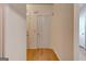 Hallway with hardwood flooring and neutral walls leading to other rooms at 3802 Austin Park Ln, Decatur, GA 30032