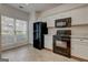 Bright kitchen featuring white cabinets, black appliances, and tile flooring at 3802 Austin Park Ln, Decatur, GA 30032